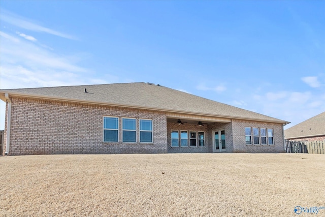 back of property with ceiling fan