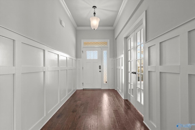 doorway with dark wood-type flooring and crown molding