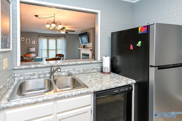 4967 Seven Pine Cir Unit 4967, Huntsville, AL 35816 - kitchen featuring freestanding refrigerator, dishwasher, a chandelier, white cabinets, and light countertops