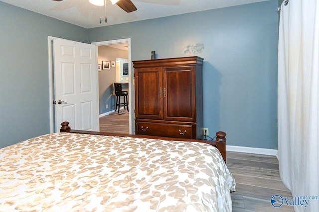 4967 Seven Pine Cir Unit 4967, Huntsville, AL 35816 - bedroom featuring wood finished floors, baseboards, and ceiling fan