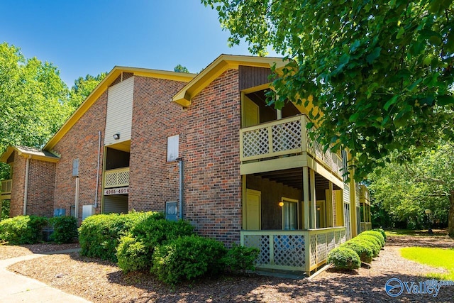 4967 Seven Pine Cir Unit 4967, Huntsville, AL 35816 - view of side of home featuring brick siding and a balcony