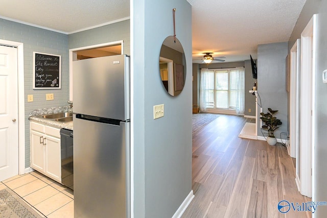 4967 Seven Pine Cir Unit 4967, Huntsville, AL 35816 - kitchen featuring freestanding refrigerator, dishwasher, a ceiling fan, a sink, and light wood-style floors