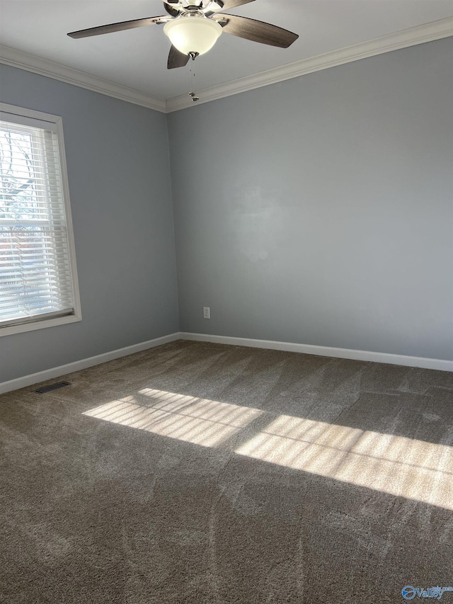 carpeted empty room featuring ceiling fan and ornamental molding