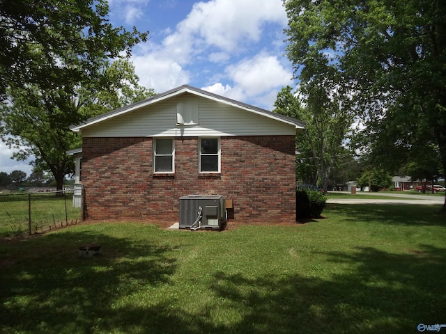 186 Brady Dr, Hazel Green, AL 35750 - view of side of property featuring central AC unit and brick siding