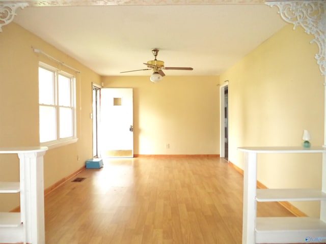 186 Brady Dr, Hazel Green, AL 35750 - spare room with light wood-style flooring, ceiling fan, and baseboards