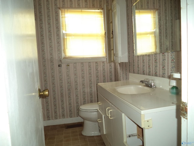 186 Brady Dr, Hazel Green, AL 35750 - bathroom with wallpapered walls, toilet, and vanity