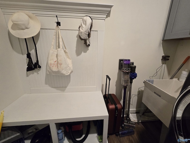 mudroom with sink and dark hardwood / wood-style floors