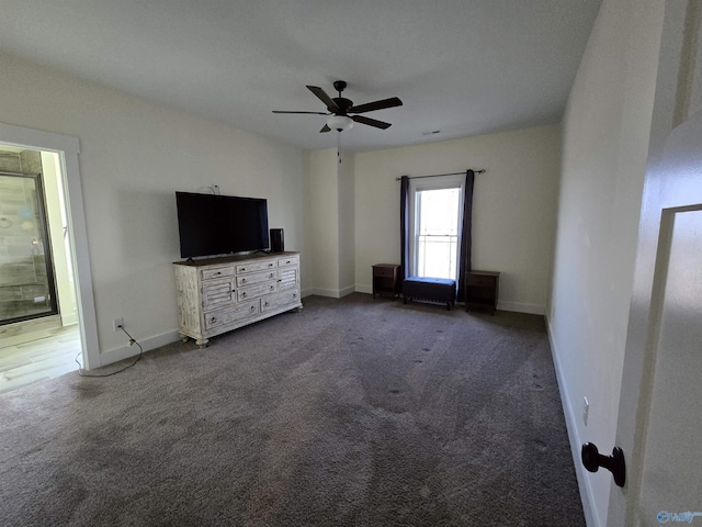 unfurnished living room with ceiling fan and carpet