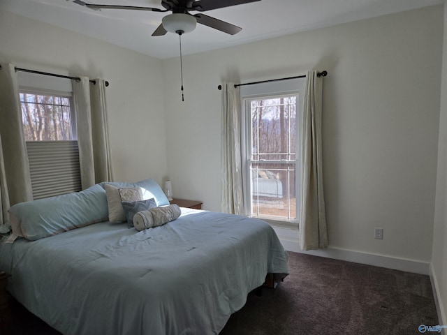 bedroom featuring ceiling fan and carpet