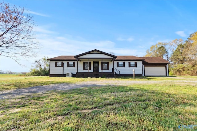 view of front of house with a front yard, driveway, and an attached garage