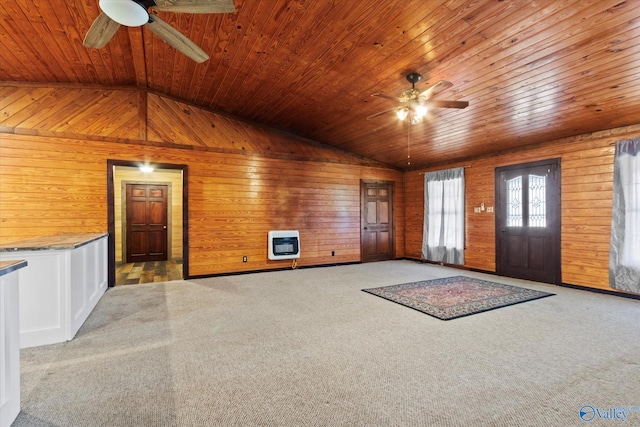 interior space with heating unit, vaulted ceiling, and ceiling fan