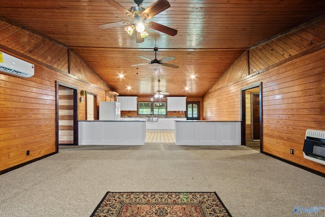 unfurnished living room with wood walls, ceiling fan, lofted ceiling, heating unit, and a wall unit AC