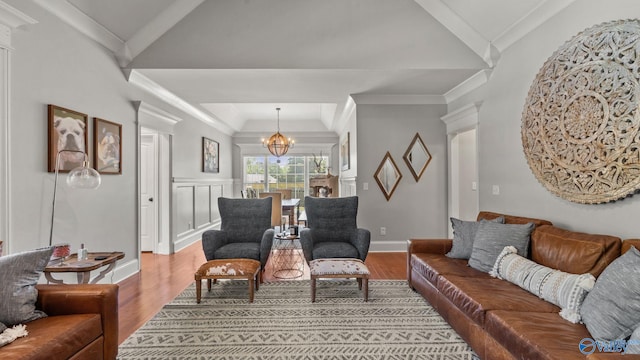 1943 Old Big Cove Rd SE, Owens Cross Roads, AL 35763 - living area featuring wood finished floors, a chandelier, and baseboards
