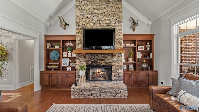 1943 Old Big Cove Rd SE, Owens Cross Roads, AL 35763 - living area featuring lofted ceiling, a fireplace, wood finished floors, and crown molding