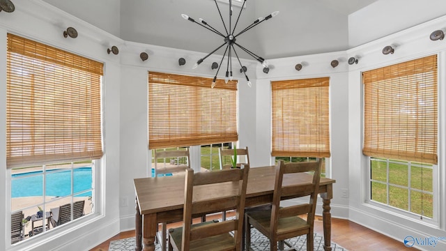 1943 Old Big Cove Rd SE, Owens Cross Roads, AL 35763 - dining area featuring a chandelier, baseboards, wood finished floors, and healthy amount of natural light