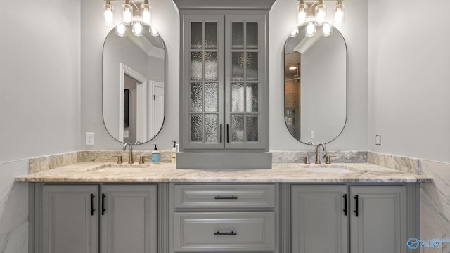 1943 Old Big Cove Rd SE, Owens Cross Roads, AL 35763 - bathroom featuring double vanity and a chandelier