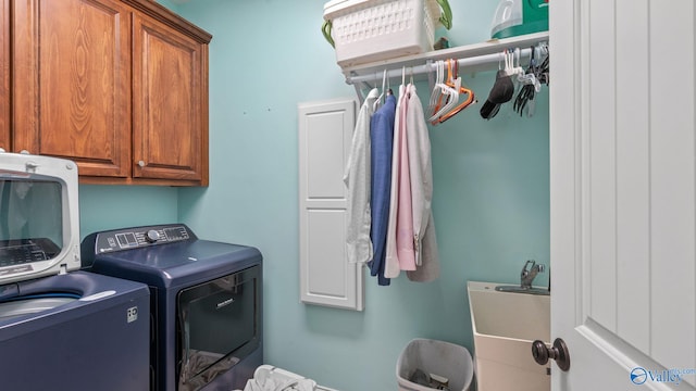 1943 Old Big Cove Rd SE, Owens Cross Roads, AL 35763 - laundry area featuring washer and dryer and cabinet space