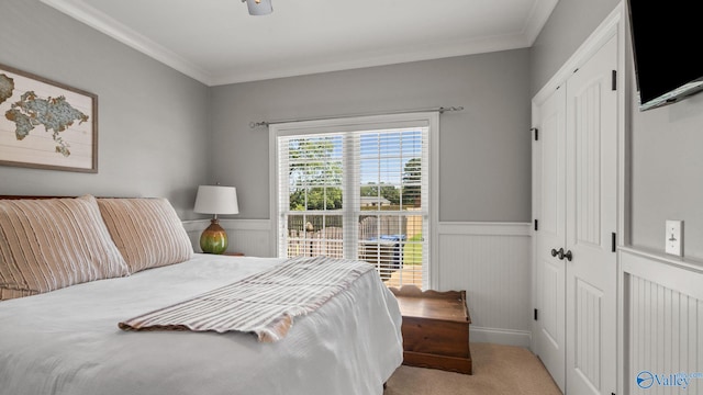 1943 Old Big Cove Rd SE, Owens Cross Roads, AL 35763 - bedroom with carpet flooring, a wainscoted wall, crown molding, and a closet