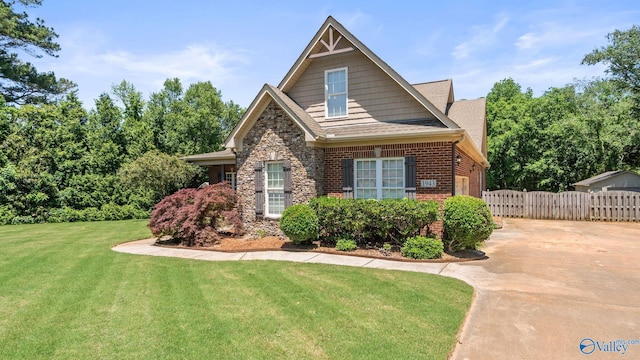 1943 Old Big Cove Rd SE, Owens Cross Roads, AL 35763 - view of front facade featuring driveway, stone siding, a shingled roof, and brick siding