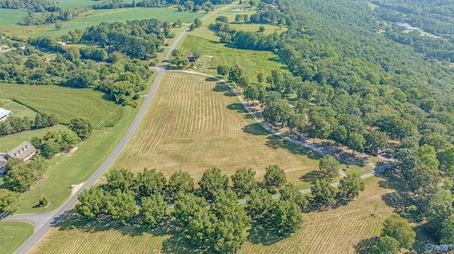 birds eye view of property with a rural view