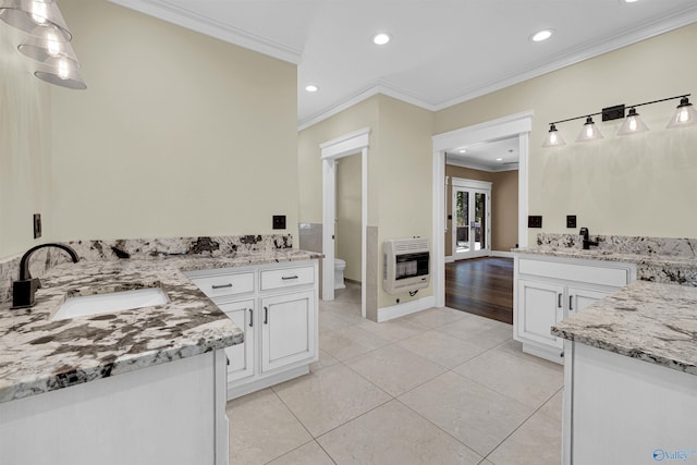 bathroom featuring vanity, crown molding, toilet, tile patterned floors, and heating unit