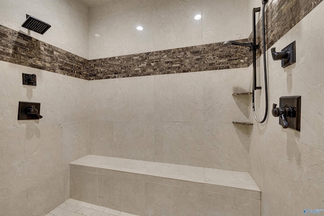 bathroom with tiled shower