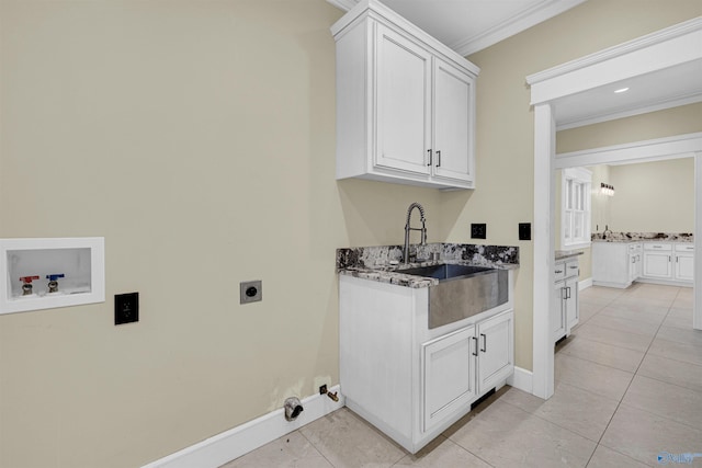 laundry room with cabinets, ornamental molding, hookup for a washing machine, sink, and hookup for an electric dryer