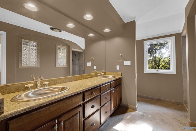 bathroom with crown molding and vanity