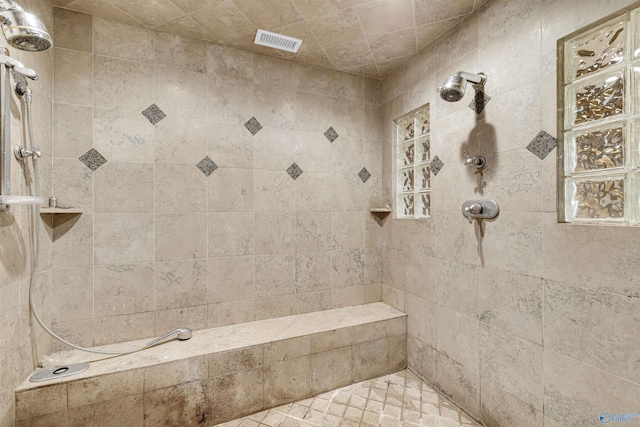 bathroom featuring tiled shower