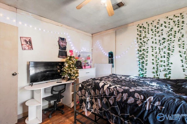 bedroom featuring hardwood / wood-style flooring and ceiling fan