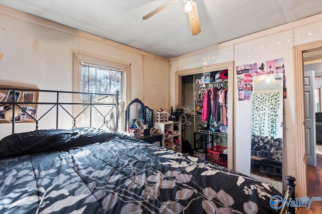 bedroom with ceiling fan and a closet