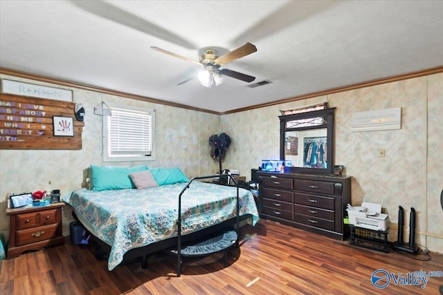 bedroom featuring wood-type flooring, ceiling fan, and ornamental molding