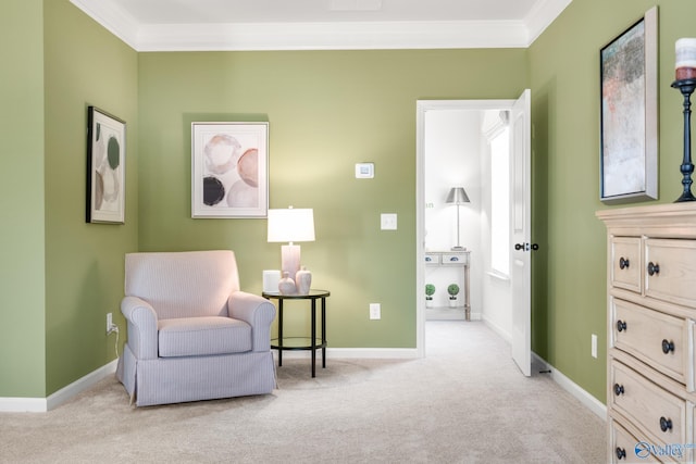 sitting room featuring light carpet and ornamental molding