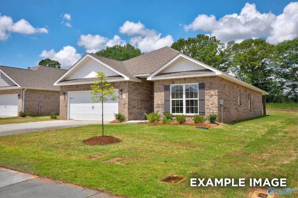 ranch-style home with a front yard, brick siding, and driveway