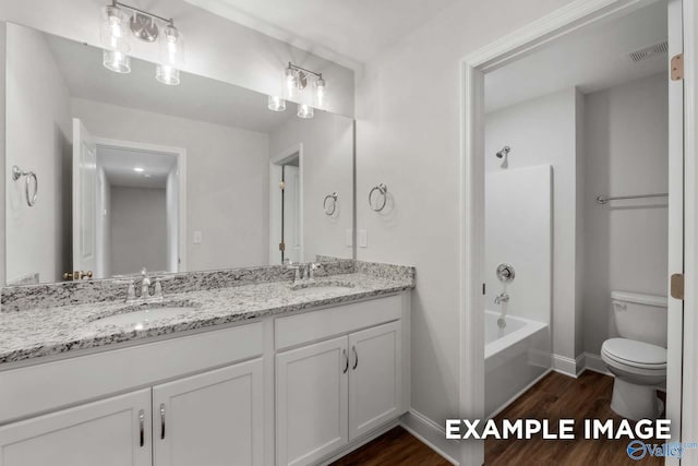 full bath featuring a sink, wood finished floors, and visible vents