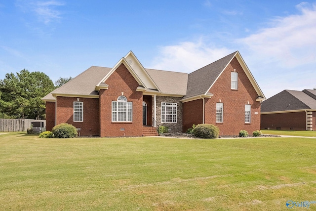 view of property featuring a front lawn