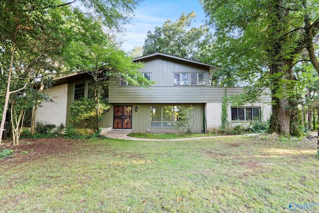 10101 Westleigh Dr, Huntsville, AL 35803 - tri-level home featuring a front yard and brick siding