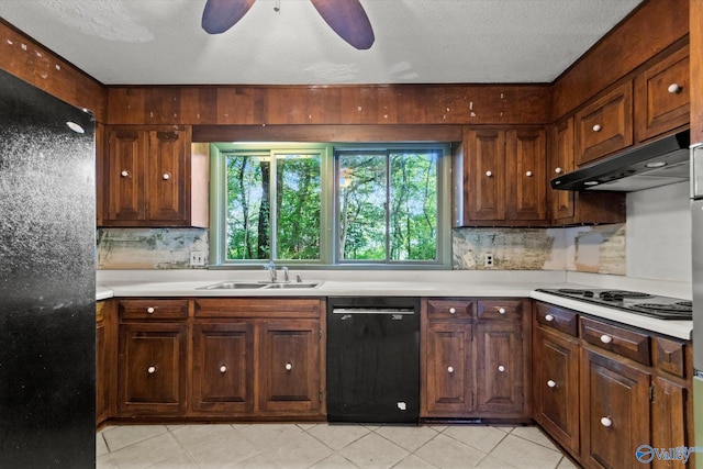 10101 Westleigh Dr, Huntsville, AL 35803 - kitchen with black appliances, under cabinet range hood, light countertops, ceiling fan, and a textured ceiling