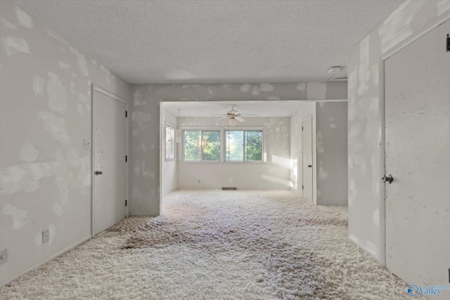 10101 Westleigh Dr, Huntsville, AL 35803 - spare room featuring carpet flooring, ceiling fan, and a textured ceiling