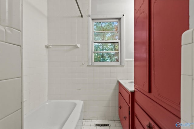 10101 Westleigh Dr, Huntsville, AL 35803 - full bath featuring tile walls, a bath, vanity, and tile patterned flooring