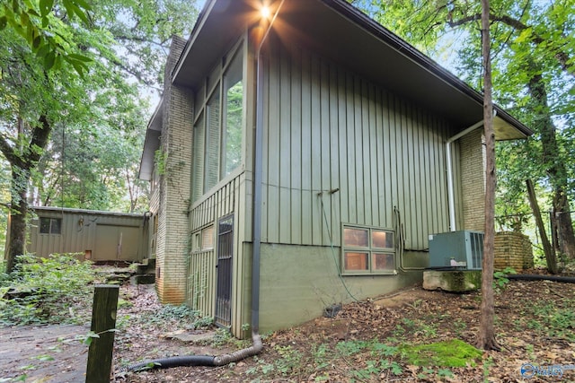 10101 Westleigh Dr, Huntsville, AL 35803 - view of property exterior with board and batten siding and brick siding