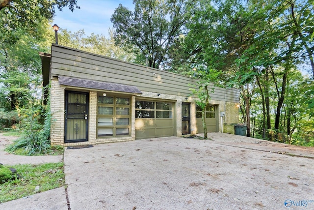10101 Westleigh Dr, Huntsville, AL 35803 - back of property with brick siding and an outbuilding