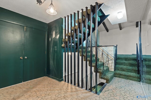 10101 Westleigh Dr, Huntsville, AL 35803 - stairway with a textured ceiling