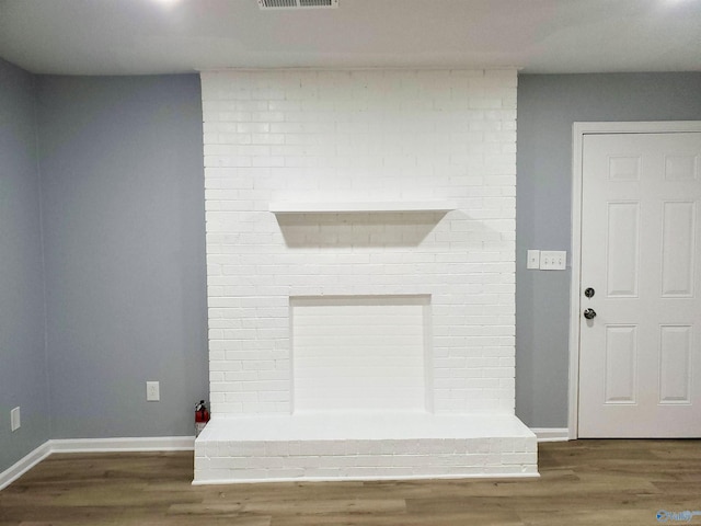 details featuring visible vents, baseboards, and wood finished floors