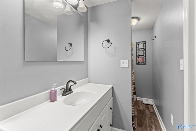 bathroom with vanity and hardwood / wood-style floors