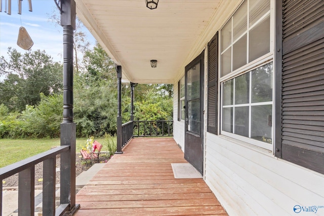 wooden terrace featuring a porch