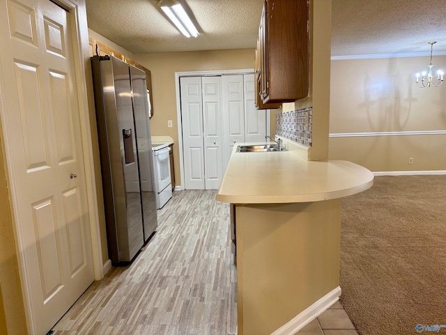 5070 Seven Pine Cir Ground, Unit Ground, Huntsville, AL 35816 - kitchen with stainless steel fridge with ice dispenser, a sink, a textured ceiling, white range with electric stovetop, and light countertops