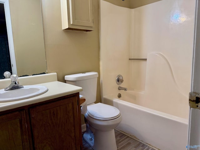 5070 Seven Pine Cir Ground, Unit Ground, Huntsville, AL 35816 - bathroom featuring toilet, vanity, bathtub / shower combination, and wood finished floors