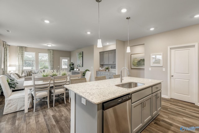 kitchen with gray cabinetry, dishwasher, dark wood-type flooring, sink, and decorative light fixtures