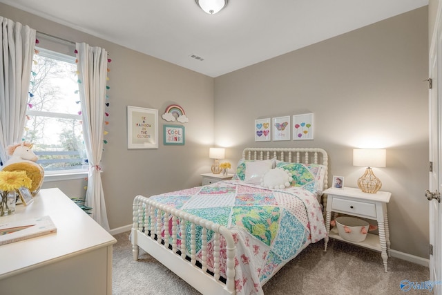 bedroom featuring light colored carpet